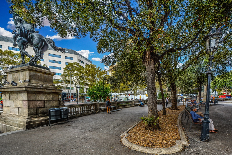 sky, building exterior, placa, building, tree, Shade, day, built structure, incidental people, Statue, Barcelona, outdoors, road, catalan, spanish, spain