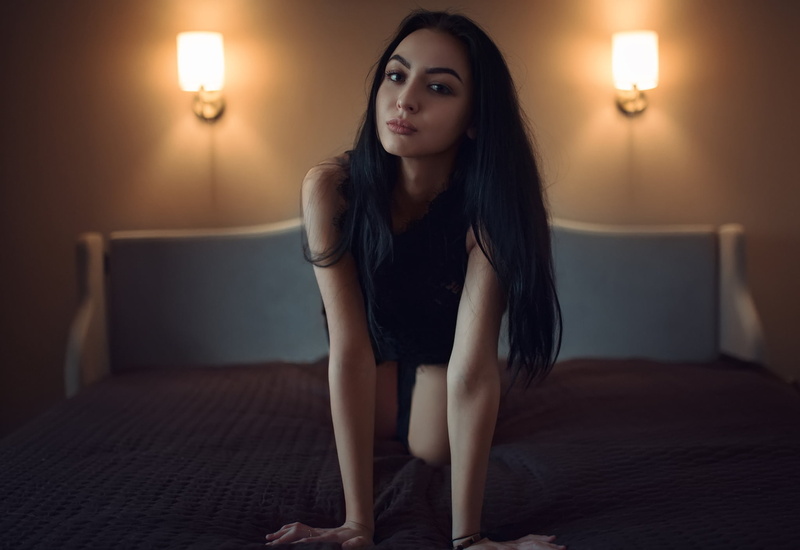 one person, looking at camera, hair, sleeveless, women, illuminated, in bed, adult, woman, young adult, wearing, contemplation, indoors, long hair, luxury