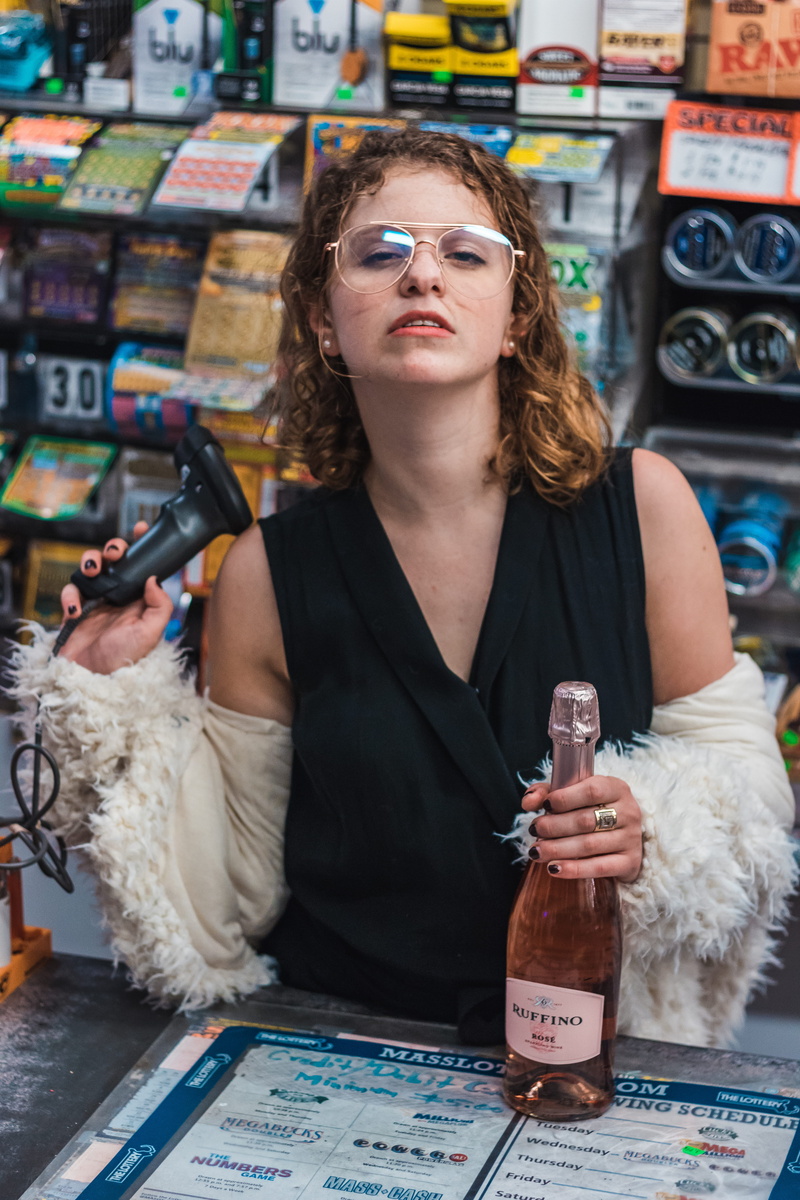 barcode, pose, glasses, container, 5K, woman, contemplation, waist up, young women, hairstyle, indoors, leisure activity, front view, wine, city, scanner