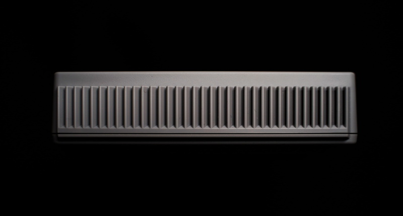 radiator, retro styled, pearl, beverage, pattern, musical instrument, brush, indoors, jewelry, stocking, metal, dark, neck, accessory, music, tool, coca