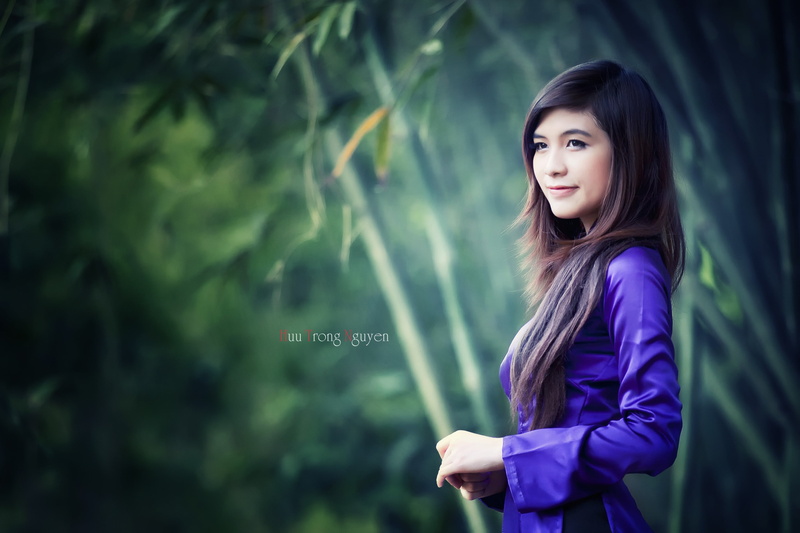 focus on foreground, contemplation, Asian, outdoors, hair, purple, long hair, Vietnam, beautiful woman, hairstyle, side view, casual clothing, waist up