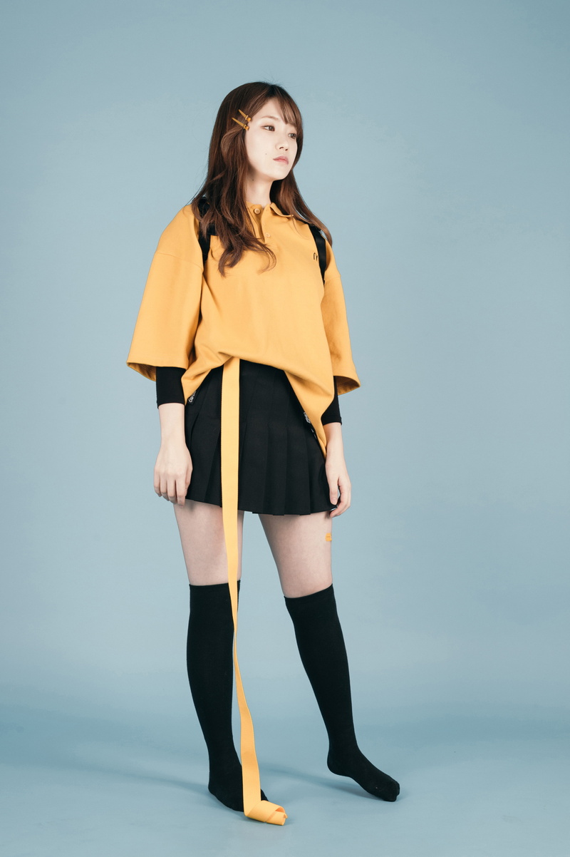 beauty, studio shot, casual clothing, lifestyles, standing, looking at camera, fashion, orange, blue background, portrait, shirt, women, sleeved, black