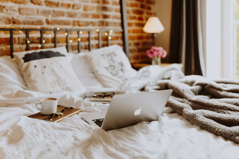 domestic room, bed, bedroom, coffee, macbook pro, apartment, laptop, loft, pillow, working, white color, bricks, focus on foreground, cozy, indoors, bedding