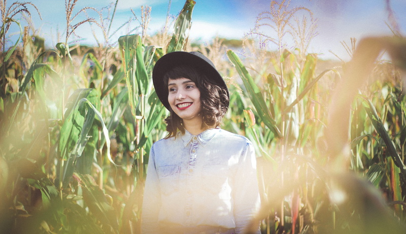 only Women, happiness, green Color, looking at camera, front view, real people, people, growth, beauty In Nature, non-Urban Scene, standing, agriculture