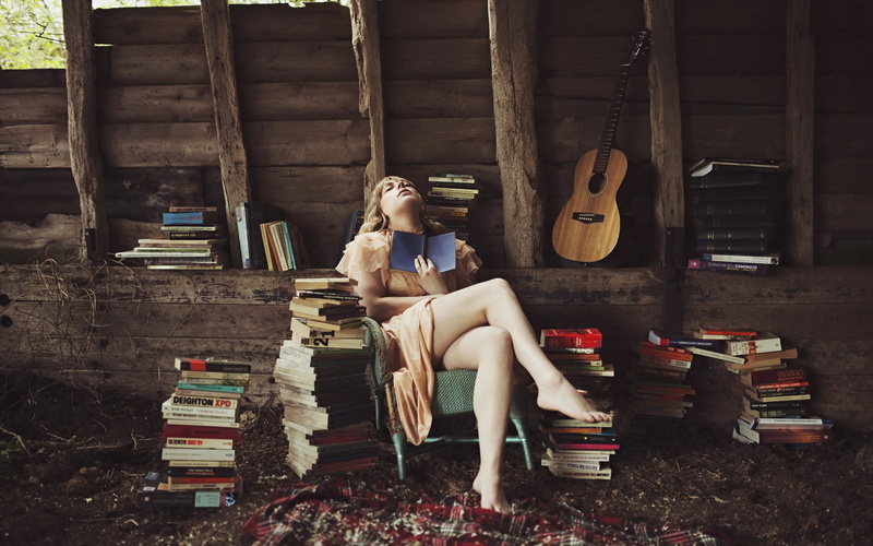 one person, sitting, sleeved, lifestyles, seat, full length, publication, book, built structure, young women, holding, short, dress, 1080P, chair, women