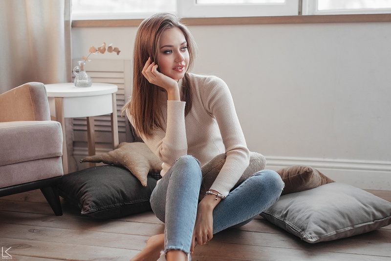 jeans, Polina Kostyuk, pillow, looking away, sitting, straight hair, women, blue eyes, brunette, model, sweater, barefoot, Sergey Freyer, 1080P