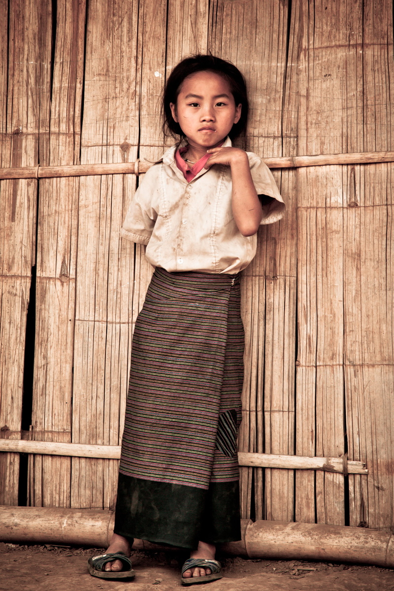 wood - material, one person, women, real people, wall, full length, wall - building feature, hmong, innocence, front view, 2K, house, black hair, village