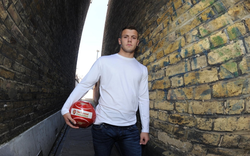 ball, brick wall, caucasian Ethnicity, young Adult, healthy Lifestyle, looking at camera, building exterior, neck, outdoors, gunners, men, arsenal, architecture