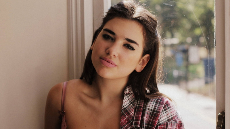 sadness, singer, women, face, looking, hairstyle, portrait, front view, window, emotion, indoors, one person, Dua Lipa, headshot, young adult, brown hair
