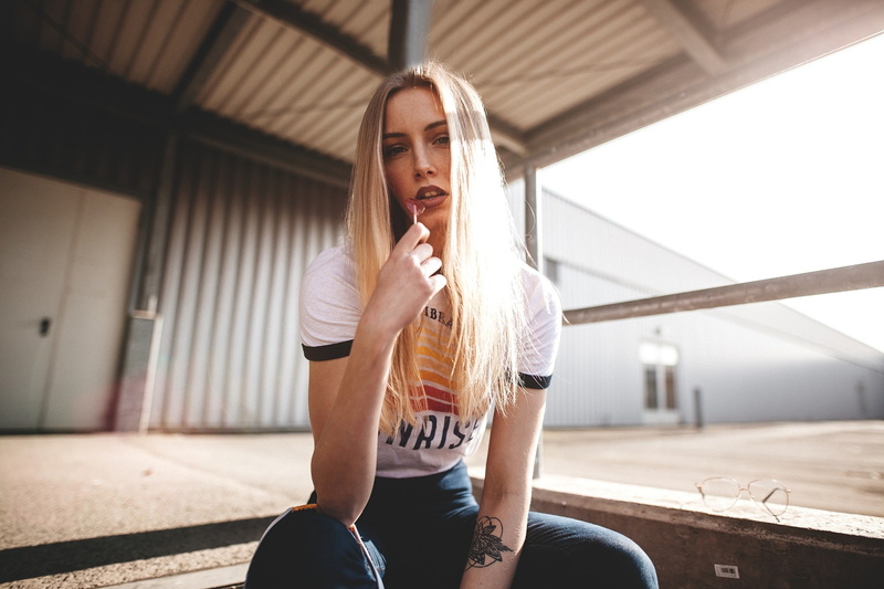 tattoo, day, young adult, lollipop, white shirt, real people, leisure activity, front view, beautiful woman, young women, architecture, one person, hair