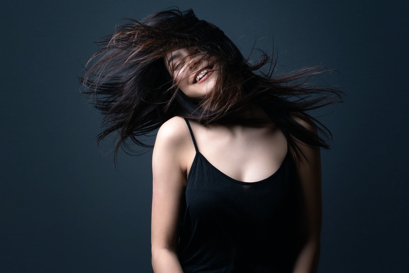 tank top, black background, tousled hair, 1080P, indoors, human hair, hair toss, hair, wind, young women, beautiful woman, black color, model, front view