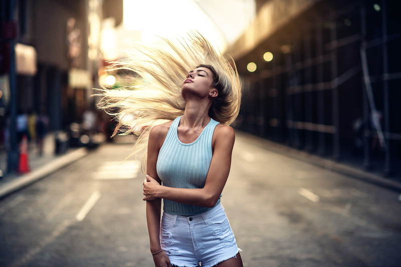blond hair, casual clothing, dancing, hair toss, lifestyles, young women, beautiful woman, hairstyle, women, young adult, outdoors, street, city, portrait