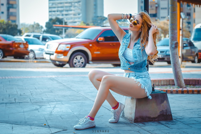 outdoors, socks, hairstyle, motor vehicle, 1080P, sitting, women, lifestyles, sunglasses, one person, Hands In Hair, fashion, hair, city, mode of transportation