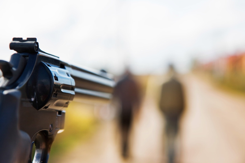 hand, focus on foreground, violence, weapon, villain, copy space, close-up, robbery, male, group, holding, criminal, handgun, single object, murderer, focus