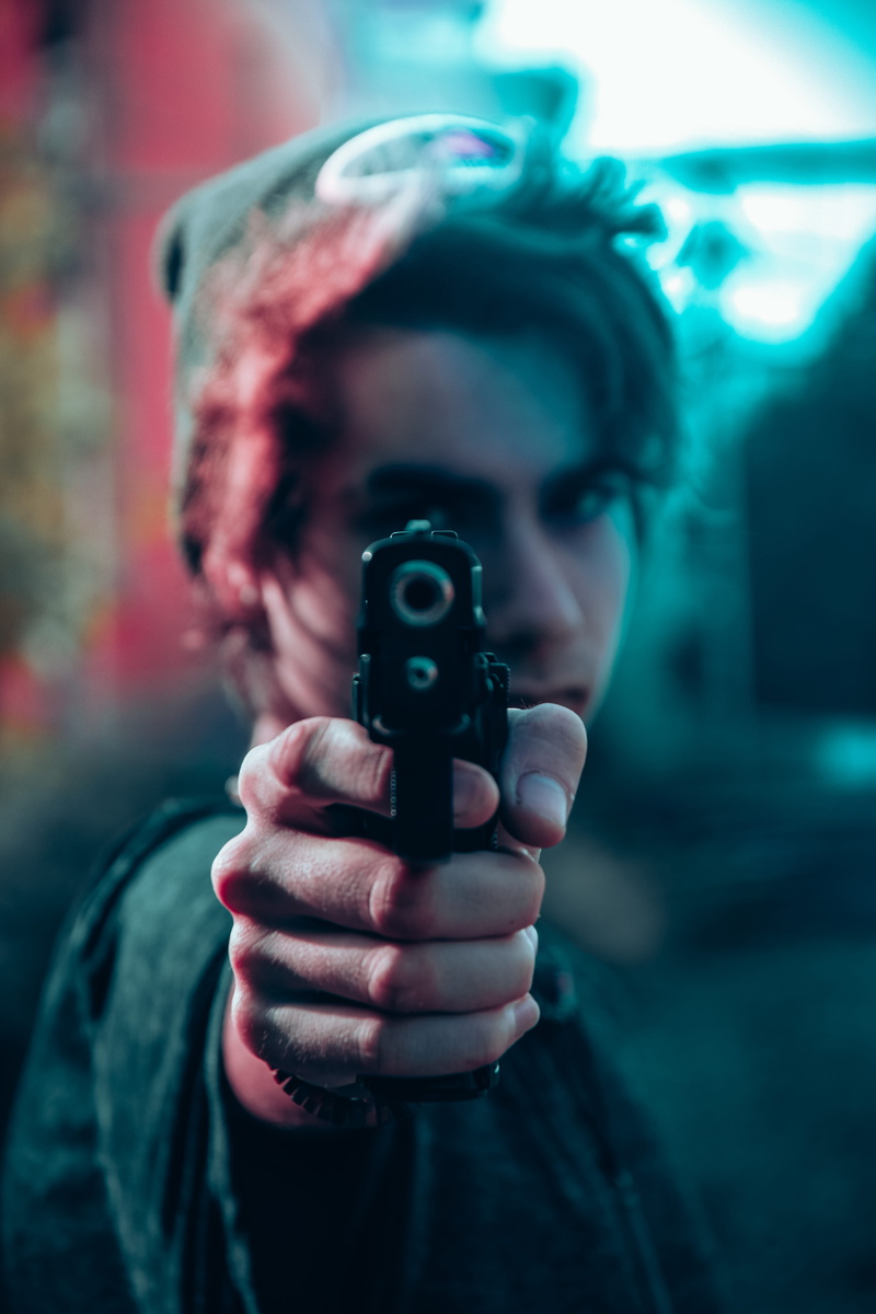 clothing, hood - clothing, focus on foreground, one person, human body part, communication, young adult, real people, casual clothing, front view, pointing