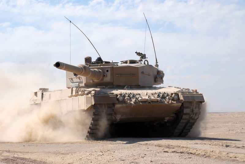 tank, mode of transportation, armed forces, armor, no people, land, cloud - sky, armored tank, military, combat, battle, wheel, dust, outdoors, desert
