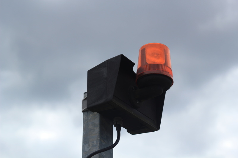 road signal, no people, alarm system, yellow, lamp, sign, sky, guidance, red light, nature, surveillance, lighting equipment, alarm, outdoors, control