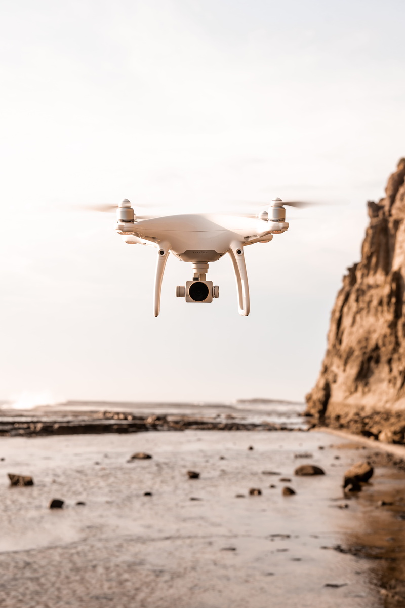 white, flight, flying, no people, airplane, focus on foreground, rock - object, warm, sea, bird, phantom, transportation, land, dji, beach drone, nature