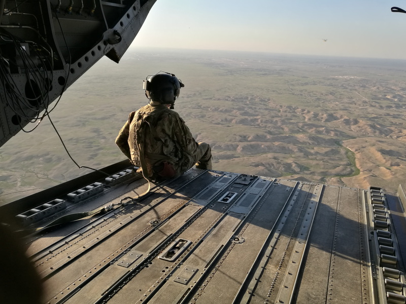 environment, outdoors, two people, looking at view, mid-air, beauty in nature, government, men, iraq, airplane, sitting, transportation, air vehicle, camouflage