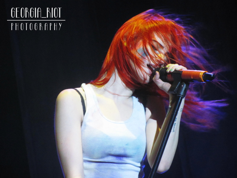 music, waist up, one person, casual clothing, 2K, black background, holding, performance, women, lifestyles, young adult, young women, Hayley Williams
