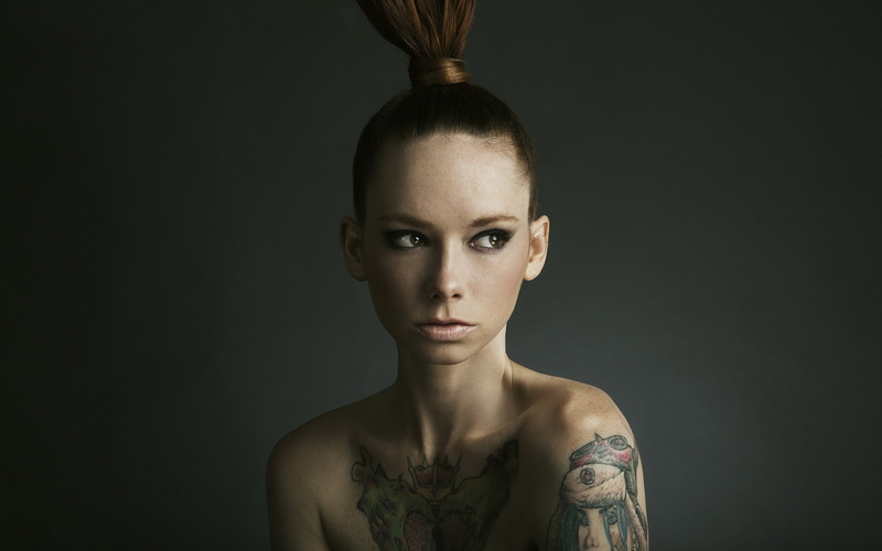 bare shoulders, looking at camera, adult, beautiful woman, young adult, front view, hairstyle, tattoo, black background, gray, portrait, headshot, fashion
