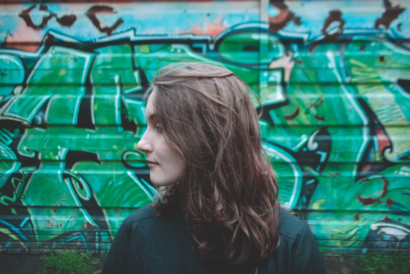 looking, beautiful woman, contemplation, black, women, female, wearing, real people, focus on foreground, lifestyles, medium-length hair, portrait, headshot