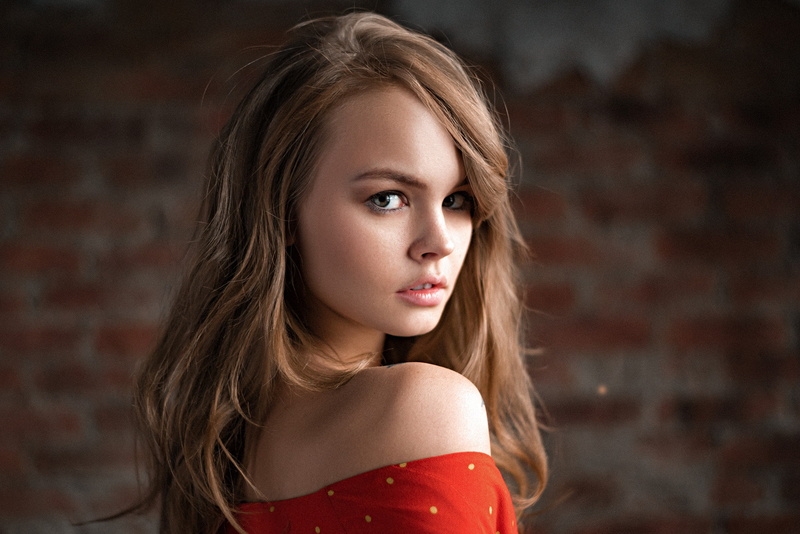 looking at camera, face, human face, beautiful people, hair, 1080P, contemplation, women, headshot, bare shoulders, bricks, portrait, hairstyle, one person