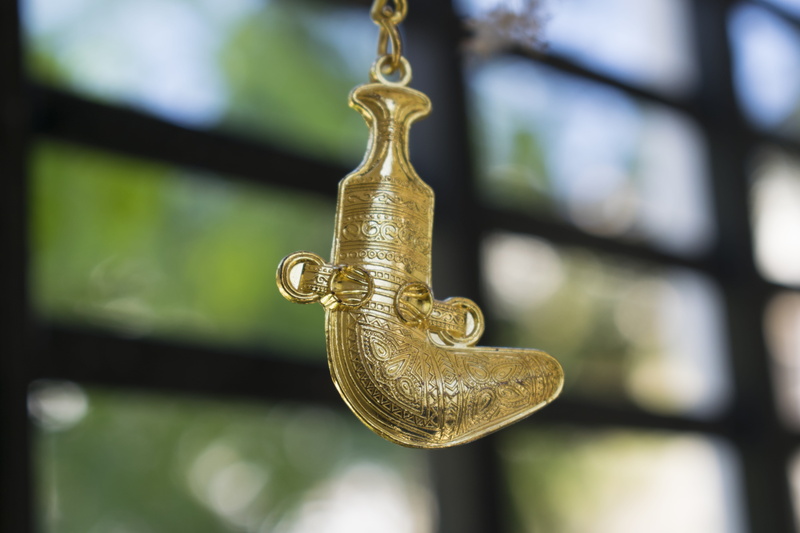 gold colored, 5K, craft, spirituality, khanjar, wood - material, omani, old, hanging, metal, focus on foreground, oman, outdoors, art and craft, close-up
