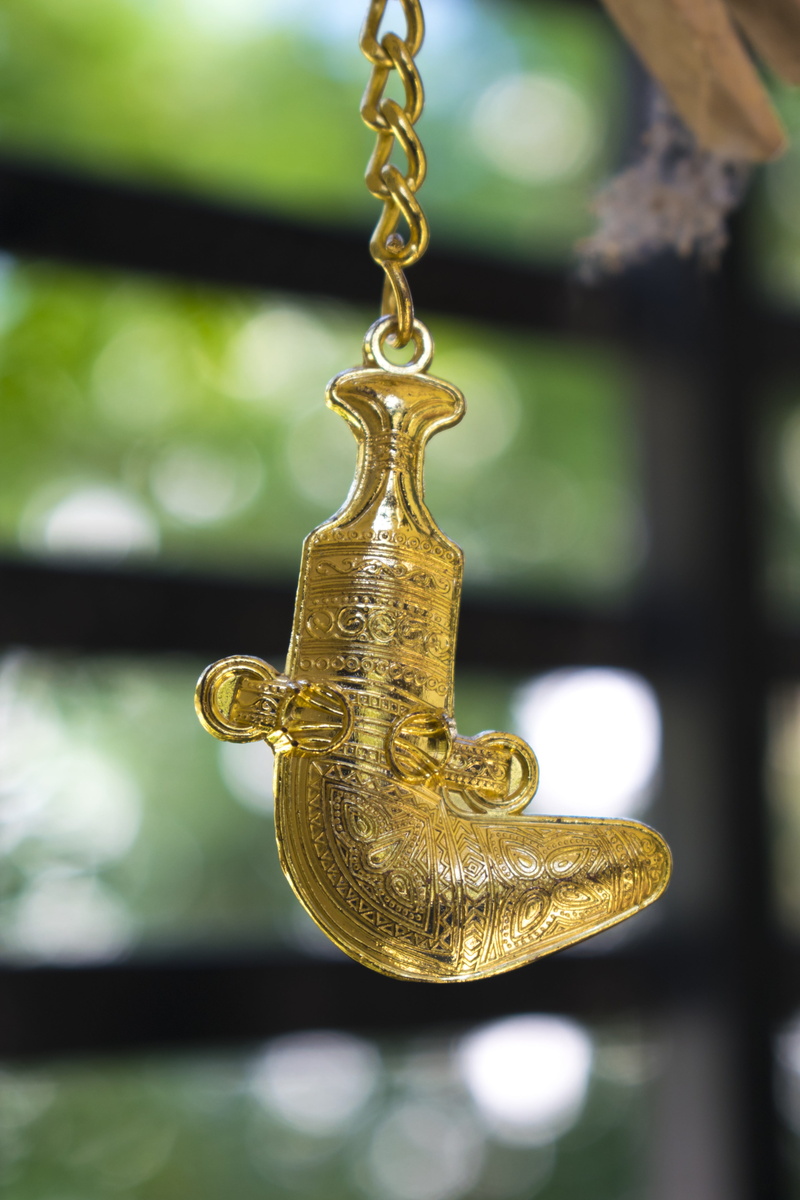 animal representation, indoors, omani khanjar, 5K, art and craft, focus on foreground, gift, gold colored, gold, religion, no people, metal, day, ornate