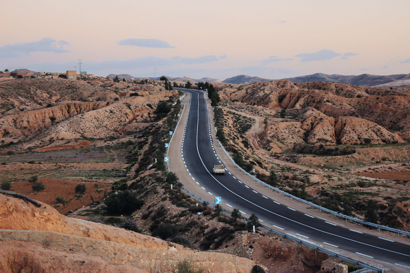nature, sky, car, mountain, no people, transportation, motor vehicle, sahara, non-urban scene, cloud - sky, rock, road, land vehicle, high angle view, mode of transportation