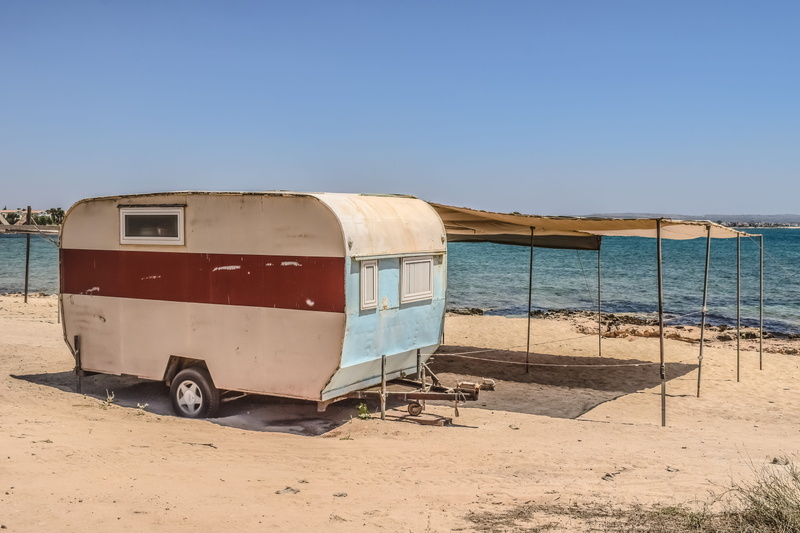 nature, trailer, land, mode of transportation, shed, cyprus, decaying, day, sky, caravan, travel, sea, improvised, water, sunny, blue, land vehicle, summer