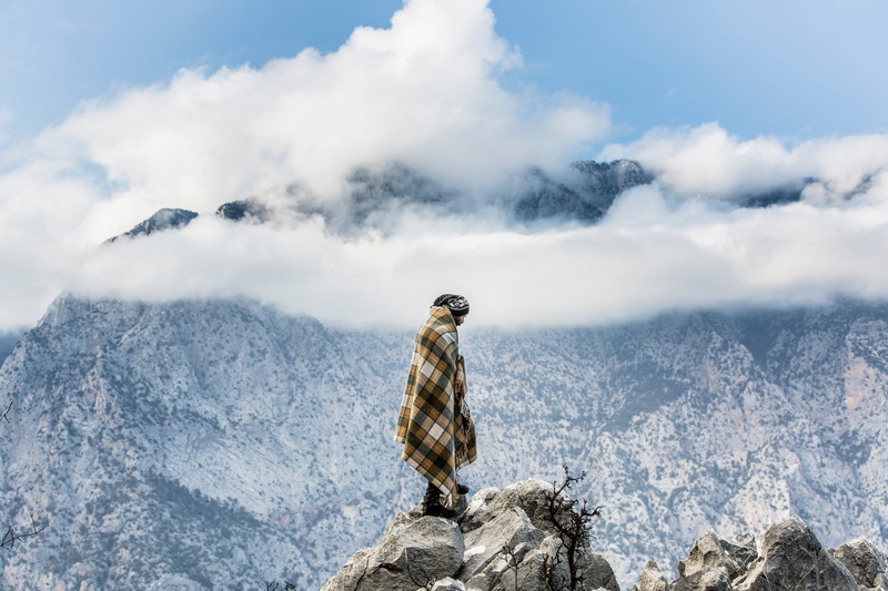 tranquility, rock - object, sky, standing, scenics - nature, cloud - sky, looking at view, selfish, one person, travel, edge, animals in the wild, adventure