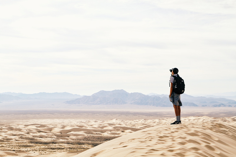 lifestyles, sand, sky, one woman only, man, backpack, mountain, arid climate, natural Phenomenon, caucasian Ethnicity, full Length, scenics - nature, time Of Day