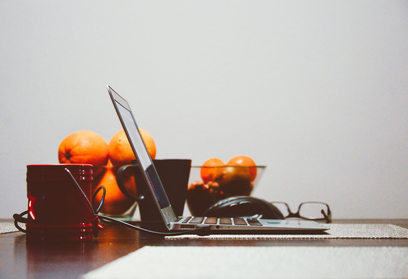 kitchen utensil, white background, orange color, indoors, 5K, food and drink, close-up, laptop, technology, clementines, wellbeing, studio shot, pro, still life