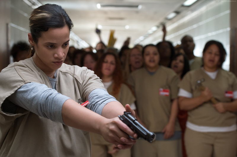women, standing, Dascha Polanco, prison, indoors, real people, group of people, young men, focus on foreground, incidental people, holding, young women