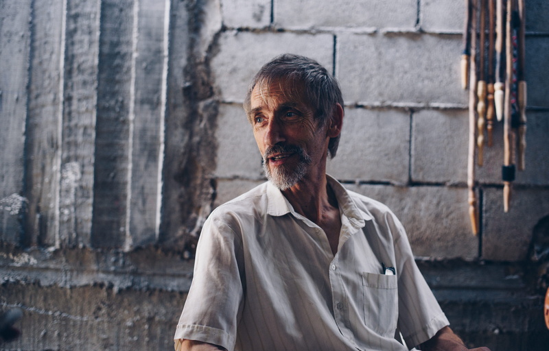 looking at camera, polo, males, wearing, real people, man, facial hair, beard, wall - building feature, mature adult, mature men, standing, lifestyles