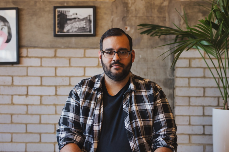 one person, young adult, beard, young men, eyeglasses, looking at camera, wearing, portrait, waist up, hairstyle, front view, shirt, hipster - person, creative exec