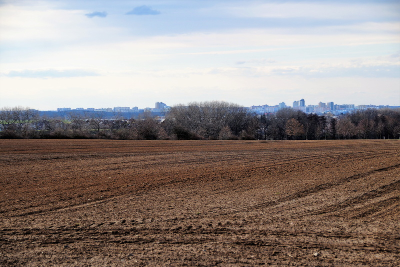 scenics - nature, beauty in nature, plough, tranquility, tree, spring, land, outdoors, brown, housing estate, field, rural scene, nature, sky, neighborhood