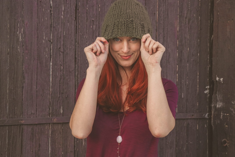 cap, smiling, young adult, 5K, leisure activity, wear, lifestyle, women, knit, close-up, maroon, wood - material, female, red hair, wearing, woman, style