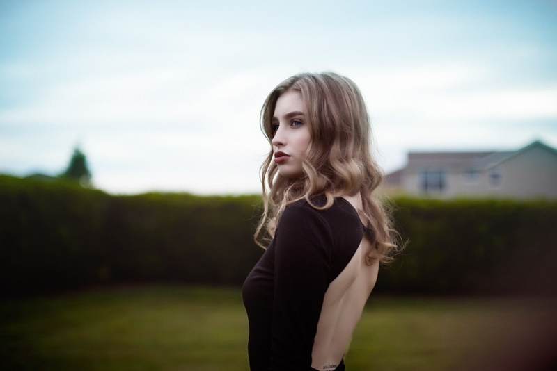 Open Back Clothing, focus on foreground, blonde, waist up, Low Back Clothing, long hair, standing, sky, young adult, 480P, hairstyle, day, model, nature