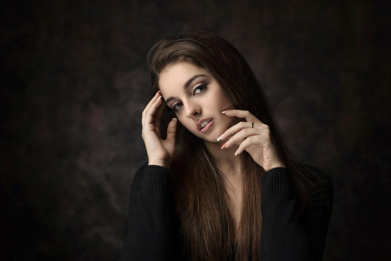 indoors, hand, brown hair, Model, beautiful woman, finger on lips, body part, young women, hairstyle, Girl, portrait, studio shot, hair, young adult, black background