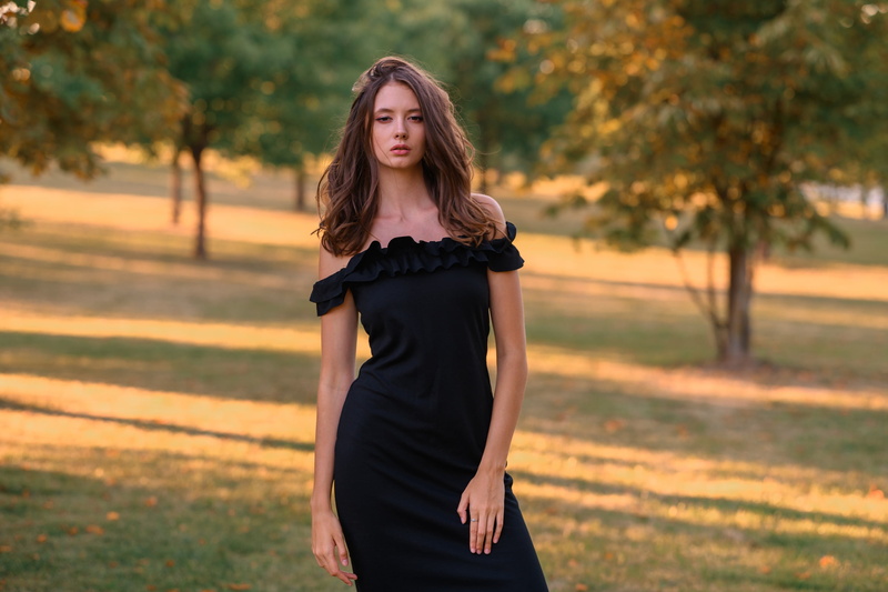 trees, wavy hair, blue eyes, looking at camera, brown hair, photographer, strapless, dress, face, photo, Sergei Vasiliev, 2K, depth of field, black dress