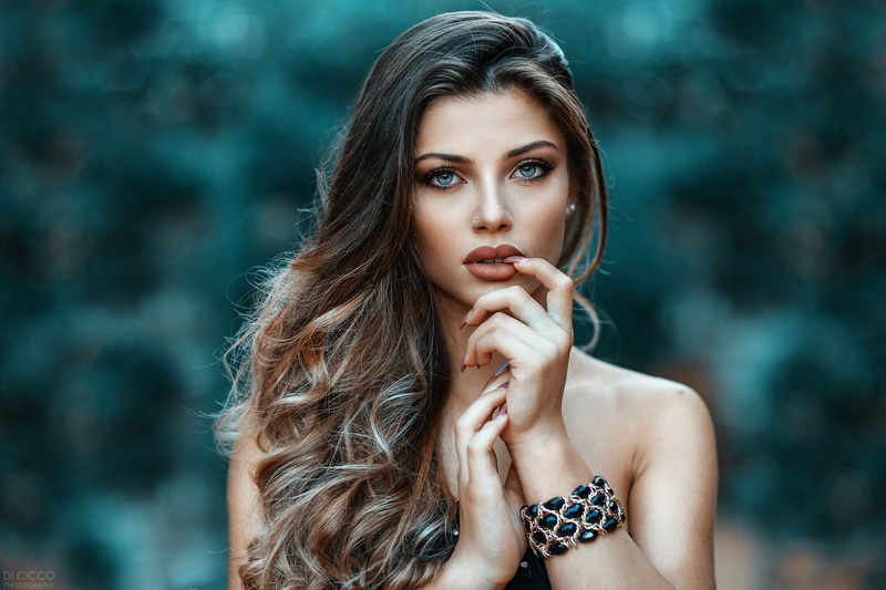 Margherita Sicignano, blue eyes, bokeh, eyeshadow, women, long hair, wavy hair, 1080P, portrait, women outdoors, pierced nose, finger on lips, face, juicy lips