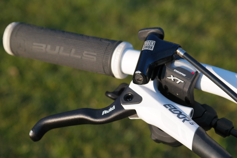 close-up, handle, mode of transportation, focus on foreground, no people, gear lever, 5K, security, rubber, outdoors, text, component, avid elixir 5, field