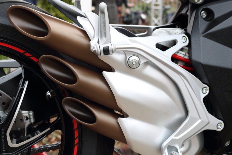 seat, motorbike, mode of transportation, luxury, motor vehicle, metal, muffler, car interior, wheel, motor, stationary, scooter, steering wheel, focus on foreground