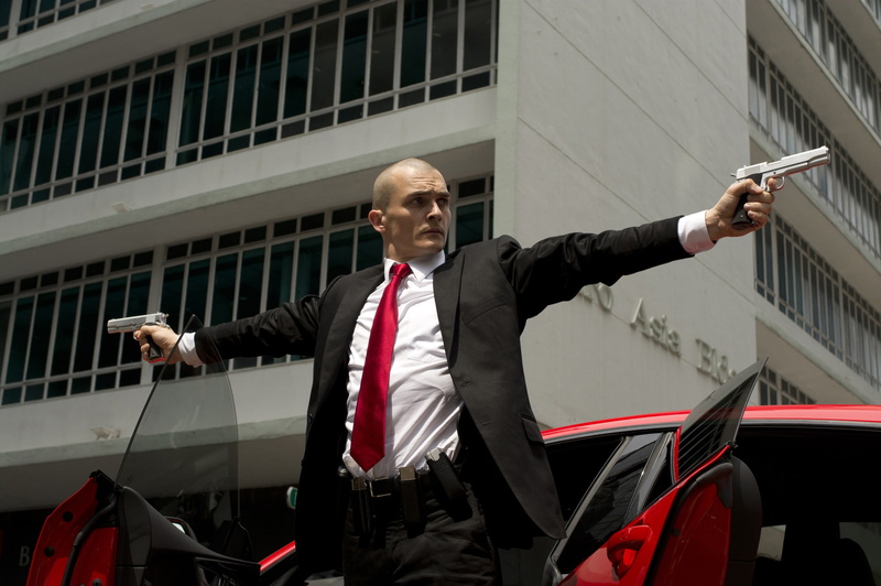 outdoors, human arm, guns, Agent 47, one person, building exterior, necktie, 2K, killer, costume, businessman, suit, males, real people, red, waist up