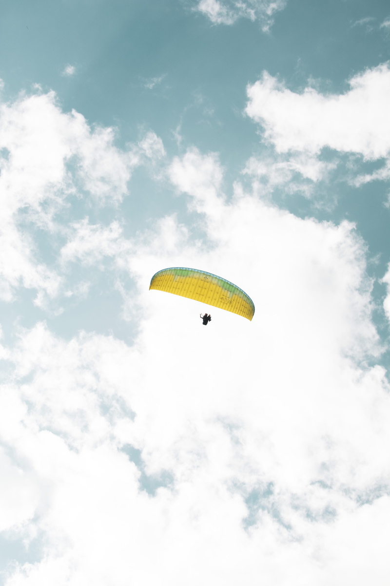 one person, mid-air, weather, cumulus, flight, 5K, interior design, indoors, clouds, lifestyles, paragliding, flying, paraglider, real people, low angle view
