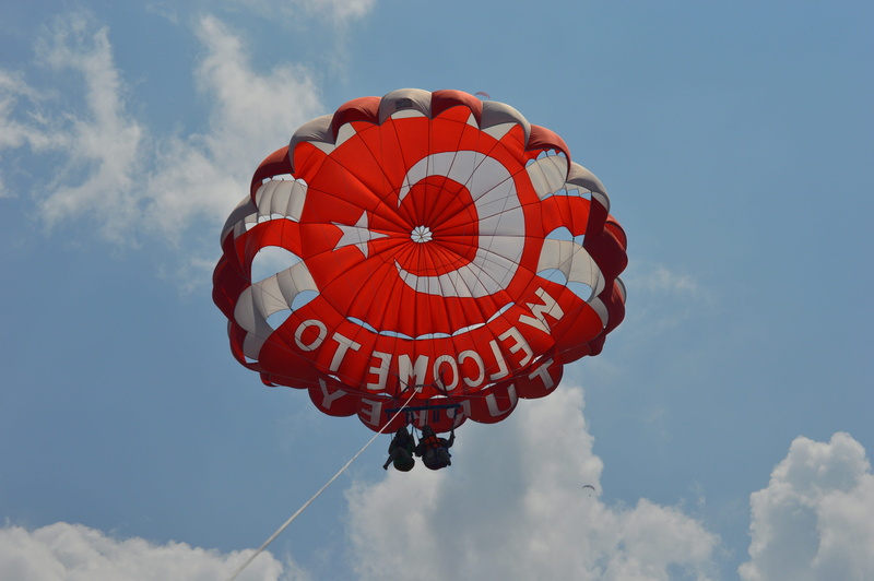 low angle view, hang gliding, rope, red, transportation, water sports, nature, flying, mid-air, pattern, adrenaline, parasailers, outdoors, parachute, above the clouds