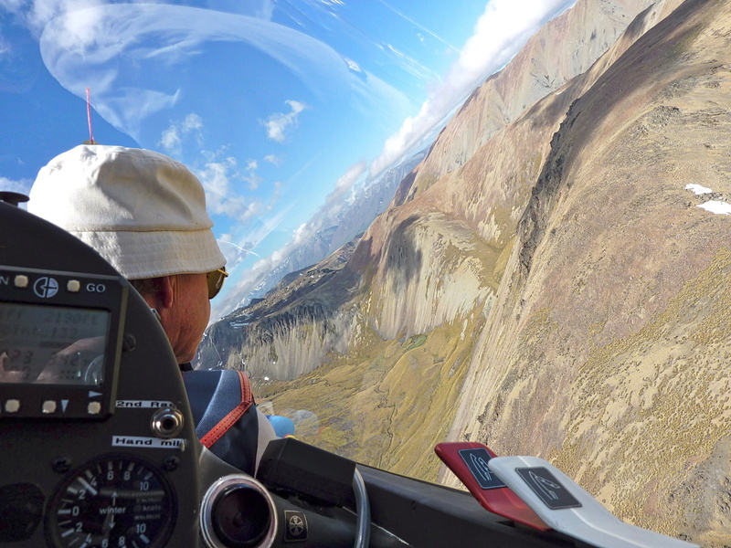 non-urban scene, glider, 2K, cold temperature, travel, dom, mode of transportation, action, pilot, scenic, day, mountain range, real people, view, cockpit