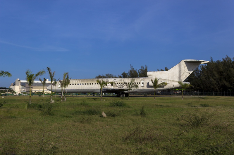 flight, day, chassis, flying, house, airport, field, sun, outdoors, approach, nature, cloud - sky, grass, wings, plane, no people, building exterior, land